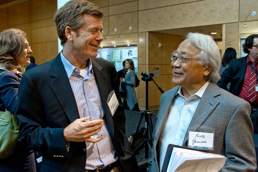 Steve Richardson, chief operating officer at Alexandria Properties, left, talks with Keith Yamamoto, PhD, vice chancellor for research, during the Mission Bay 10th anniversary event.